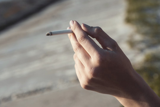 Cigarette in the hands of woman