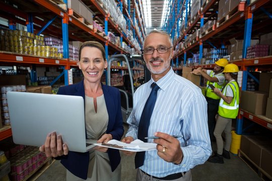 Warehouse manager and client with digital tablet 