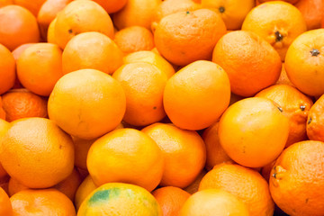Pile of fresh oranges and mandarins