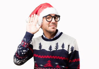 Concerned young man listening at Christmas