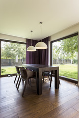 Dark table and chairs in room