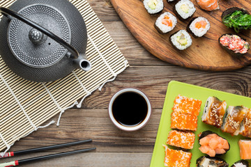 Sushi rolls with eel, salmon, avocado, and other products