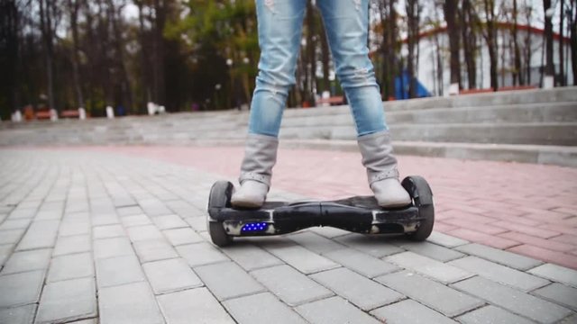 little girl riding on hyroscooter in park