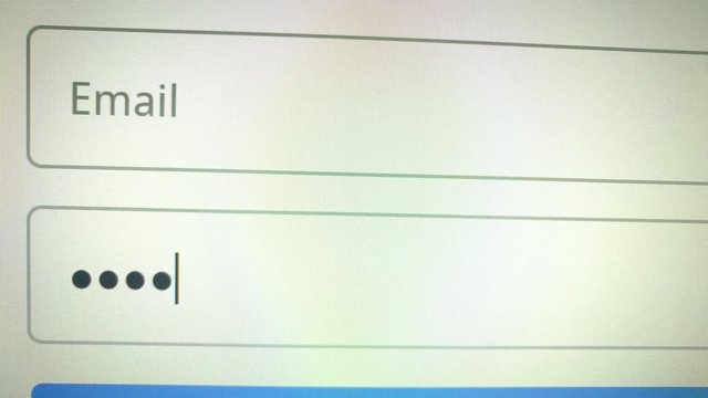 Color close up footage of a computer monitor with a field for password login.