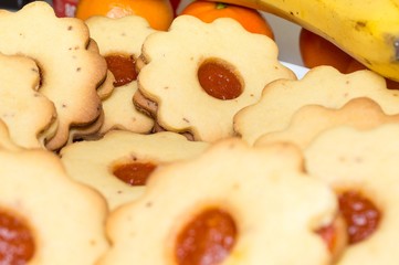 Homemade apricot jam Linzer with fruits close up