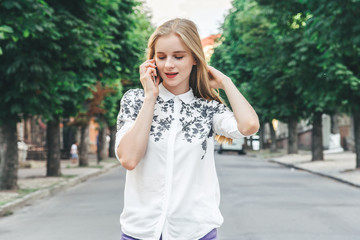 Young pretty beautiful woman girl talking on mobile phone.