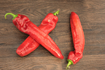 Delicious red hot chili peppers on a wooden table