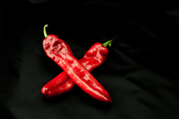 Fresh sweet red hot peppers paprika isolated on black