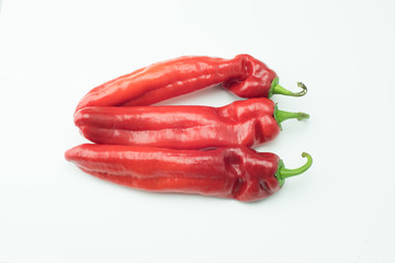 fresh sweet red peppers paprika isolated on white background