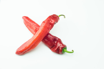 fresh sweet red peppers paprika isolated on white background