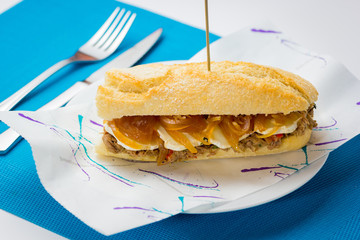 Meat sandwich with sweet onion and goat cheese