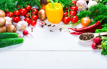 Fototapeta na wymiar Beautiful background healthy organic eating. Studio photography the frame of different vegetables and spices on the white boards with free space for you text