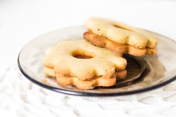 Homemade apricot jam Linzer on the white table close up