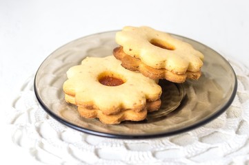 Homemade apricot jam Linzer on the white table close up