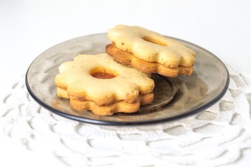 Homemade apricot jam Linzer on the white table close up