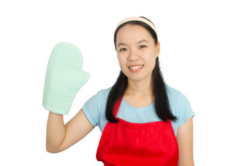 Young Asian woman wearing red apron and oven mittens ready to cooking or baking,isolated on white background