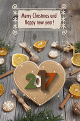 Christmas heart shaped gingerbread background. Winter holidays atmosphere. Snoflakes. Greeting card for Christmas and New Year`s Eve holiday 2017.Winter holiday poster.