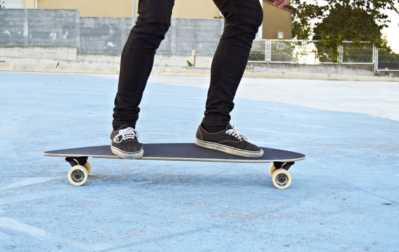 young man with longboard outdoors