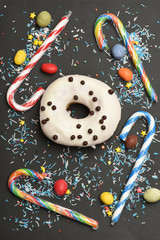 White glazed donut on black background
