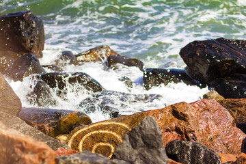 sea, waves and the pattern on the stone