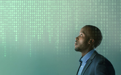 Black man with glowing green binary code background