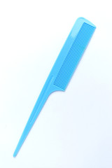Blue barber comb on an isolated white background.