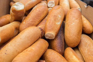 Fresh bread rolls in a box at the city market