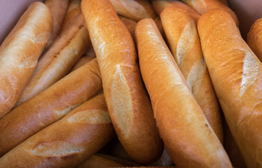 Fresh bread rolls in a box at the city market