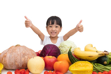 Fototapeta premium Asian Chinese little girl thumbs up with fruit and vegetable