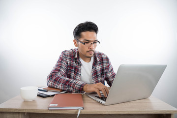 business man with laptop notebook and smartphone in the office