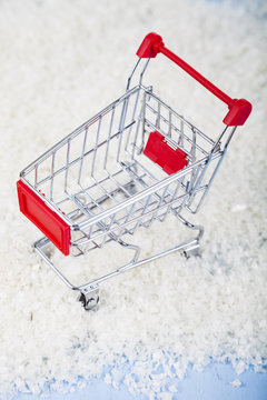 Shopping carts and Christmas decorations in the snow. Concept of