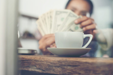 young women who are happy to count the money dollar