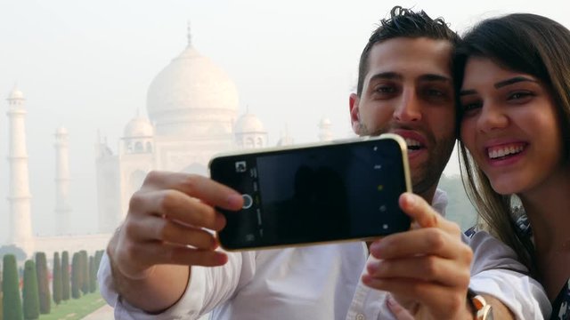 Couple taking a selfie in Taj Mahal, Agra, India