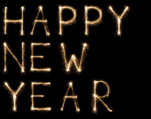 New year font sparkler text greeting on black background