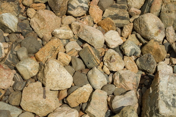 many stones of different colors and sizes