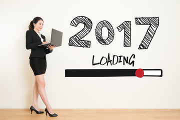 business woman using laptop computer loading now 2017