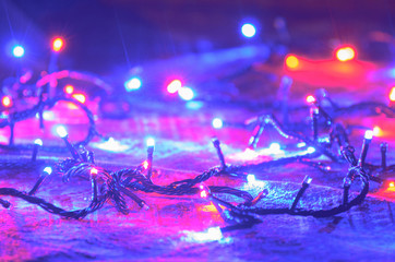 Christmas lights strands wrapped around the floor.