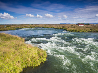 Landscape with a rushing blue river
