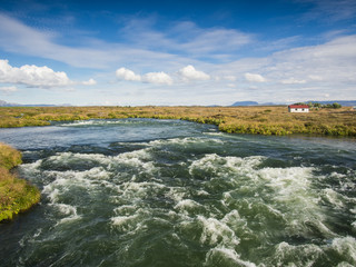Landscape with a rushing blue river
