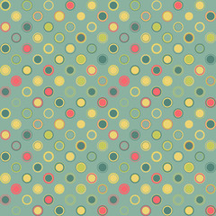 Vintage seamless pattern. Consists of geometric elements having round shape and different color, located on green background. Useful as design element for texture and artistic compositions.