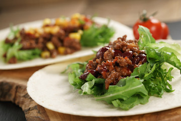 open tortilla with beef, frillice, beans and corn, organic fastfood