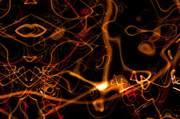 Abstract light trails on black background. Digital artwork creative graphic design.