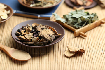 Traditional Chinese medicine on bamboo desk