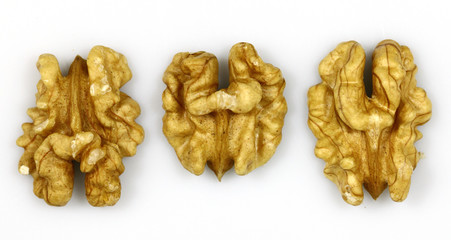 Walnut and a cracked walnut on the white background
