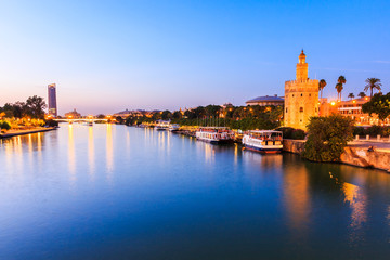 Seville, Spain. Guadalquivir river and Golden Tower (Torre del Oro)