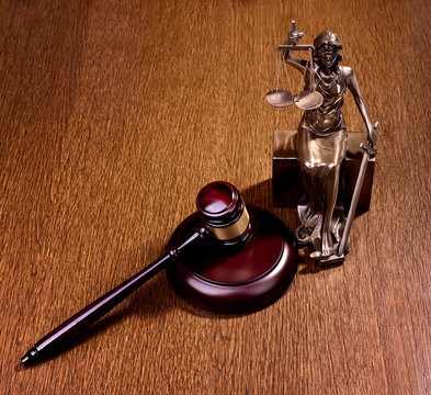 Wooden gavel on wooden table, law concept
