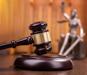 Wooden gavel on wooden table, law concept