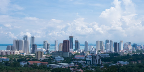 Tropical asian megalopolis. Beautiful city view with skyscrapers and the cloudy sky at the background