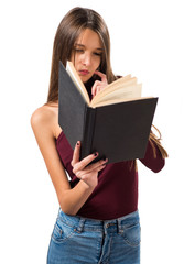 Young teenager girl reading book