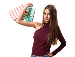 Young teenager girl with many shopping bags